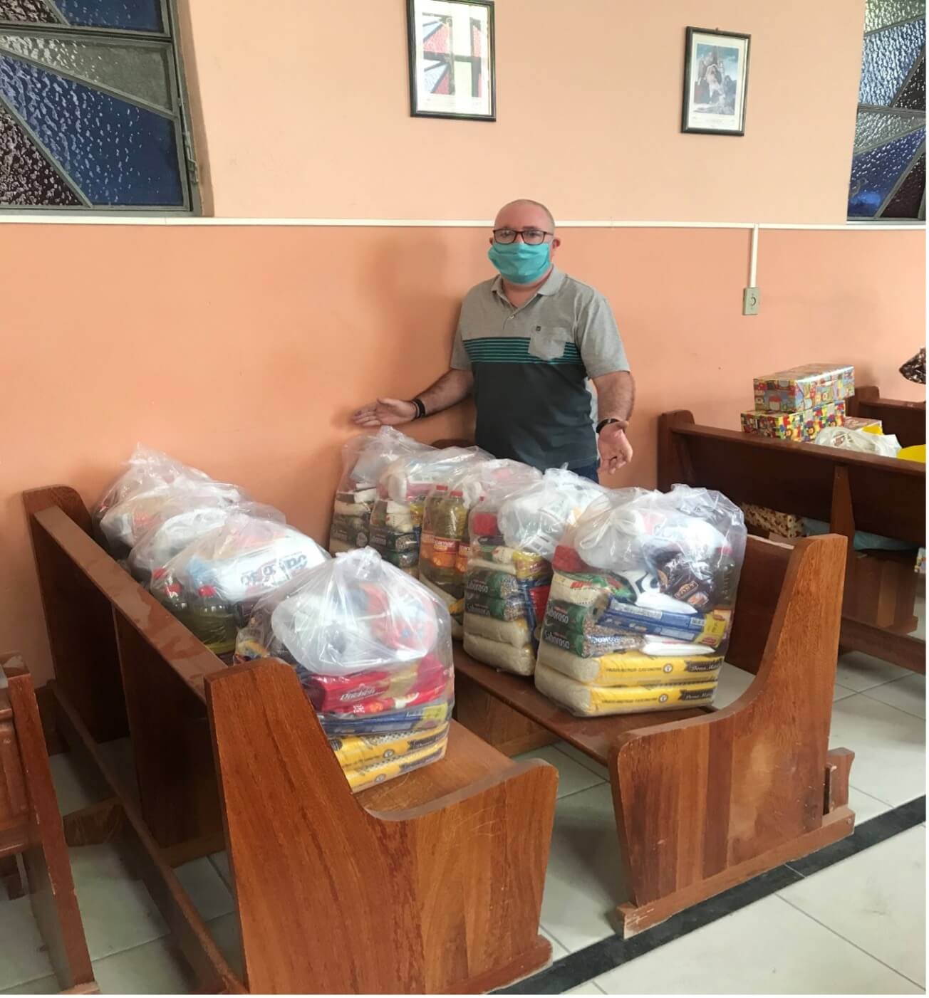 Fr Brendan is pictured with food parcels