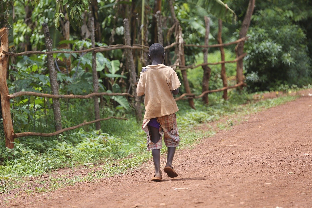 African young adult walking