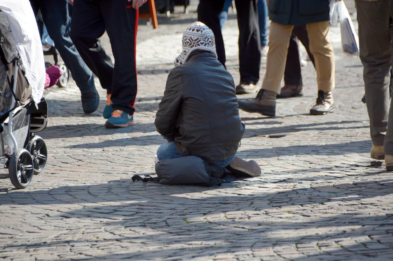 A person begging in the street