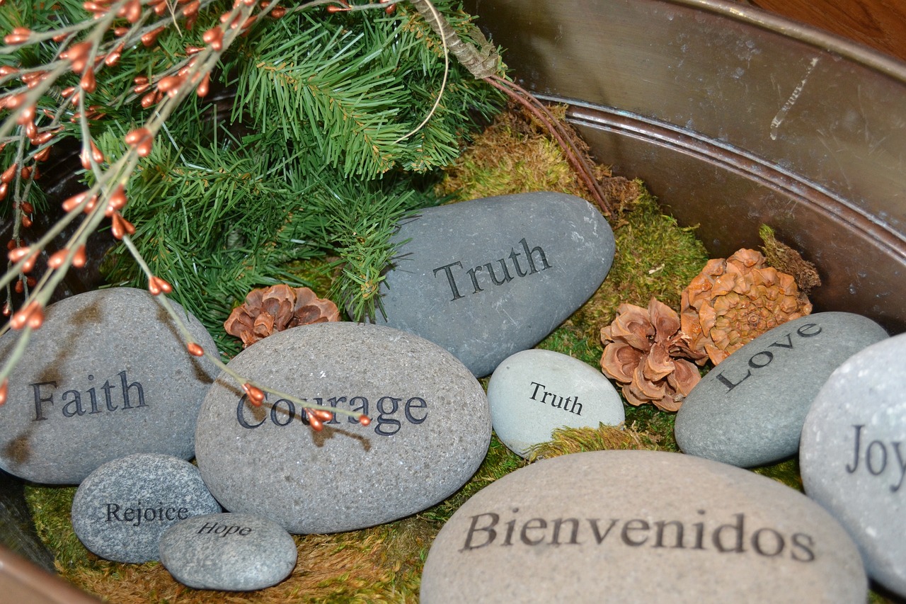 Stones with words such as courage, love, truth written on them.